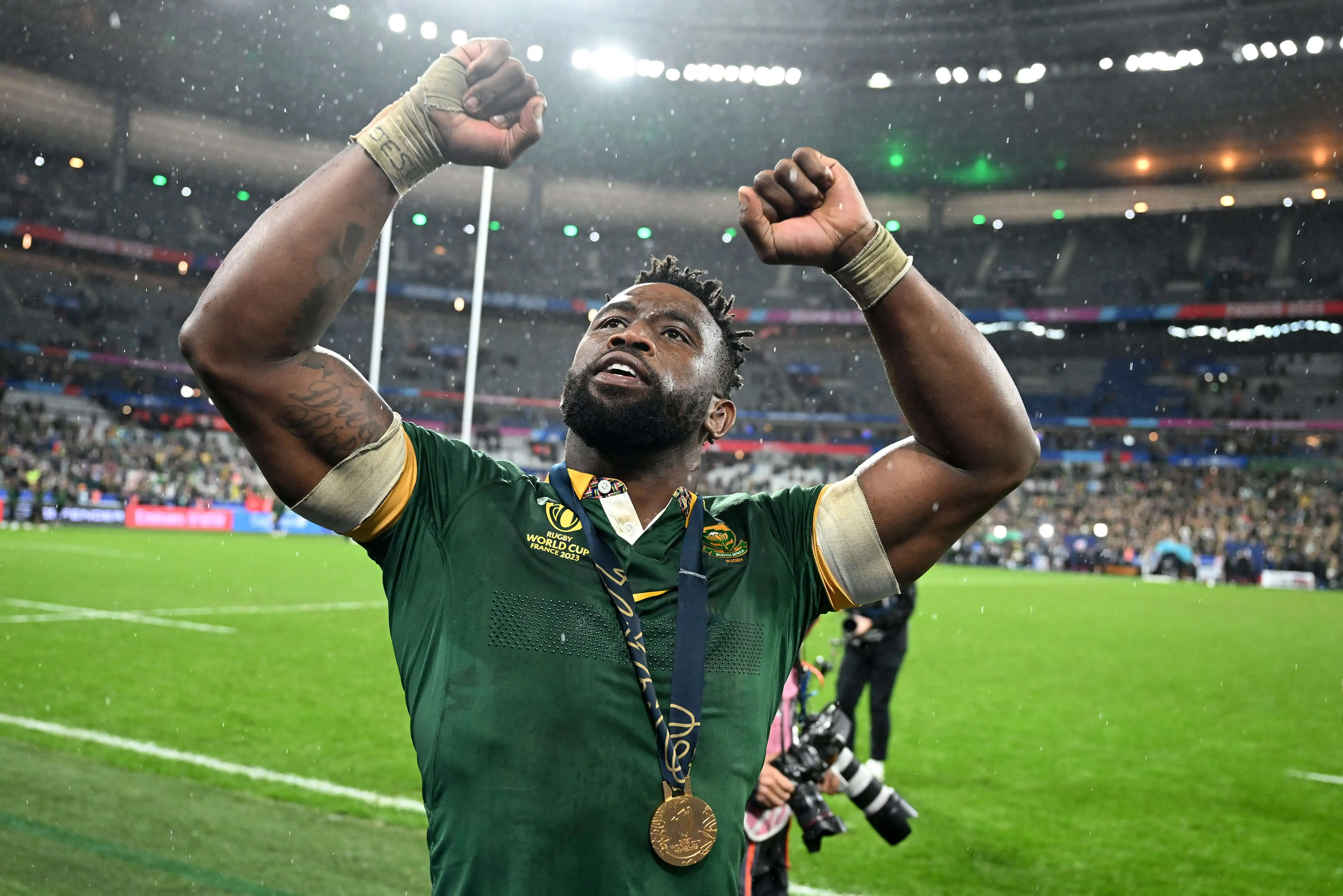 Kolisi in Sprinkbok Uniform with arms raised